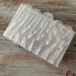Agua Bendita x Target scalloped resin clutch